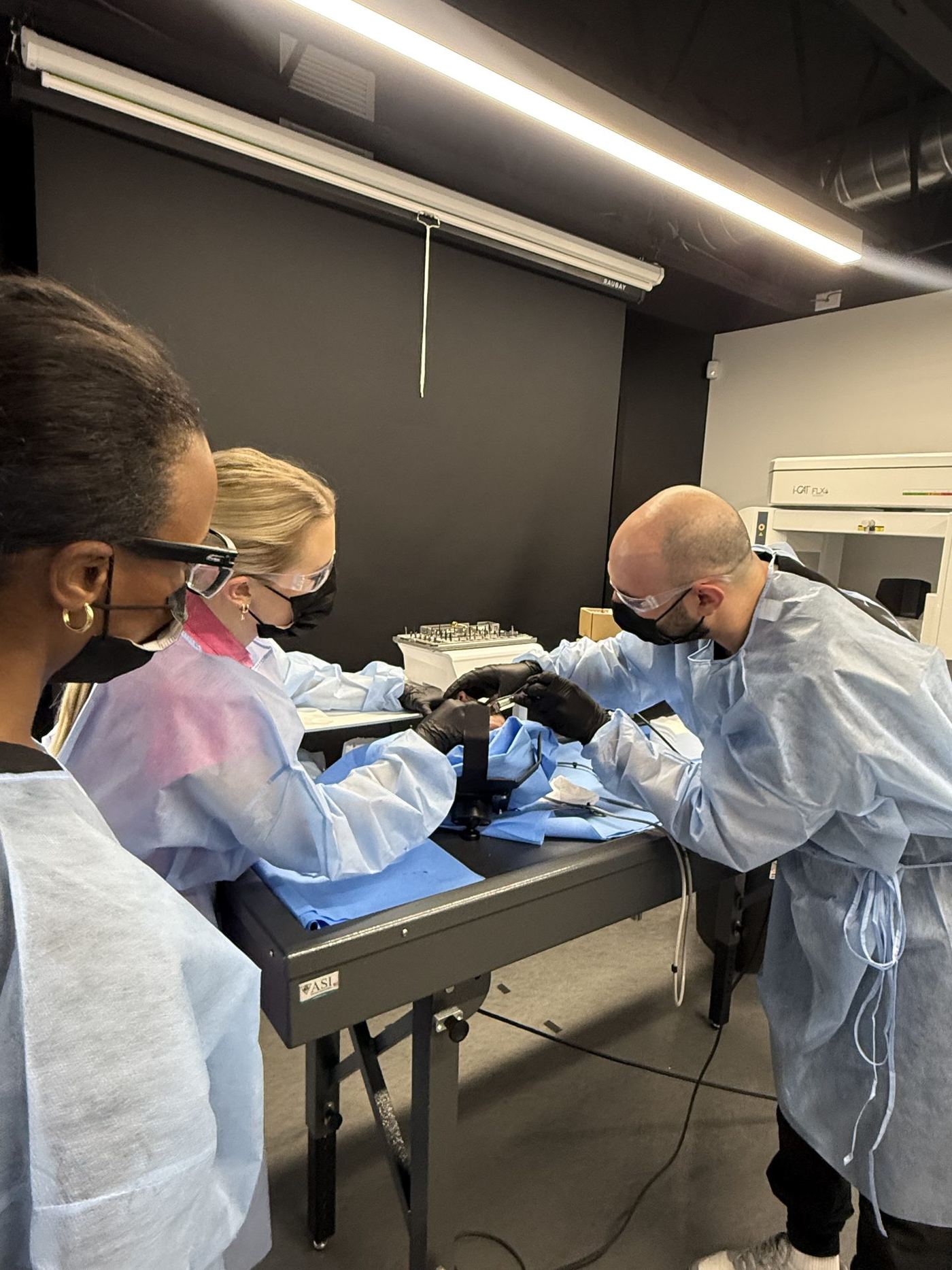 Dentist placing a dental implant in a cadaver specimen during the Level 1 dental implant cadaver course in Phoenix