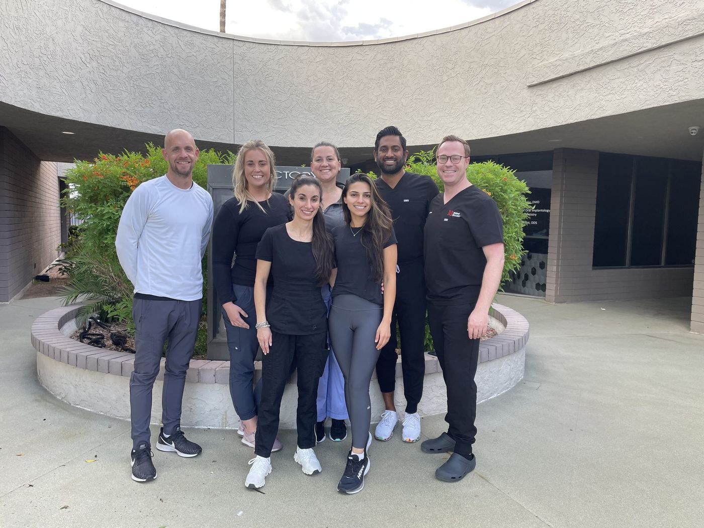 Dentists and instructors gathered after completing an implant training course