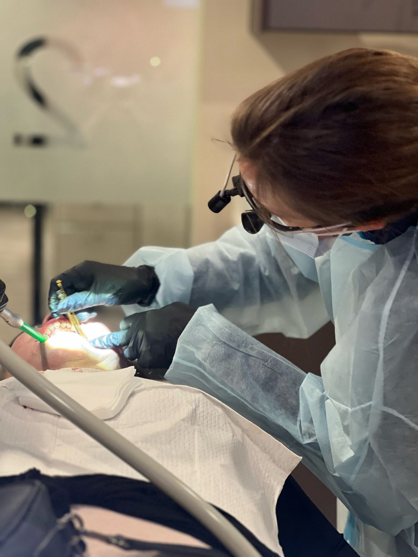 Live surgical training in progress at the Implant Education Company operatory