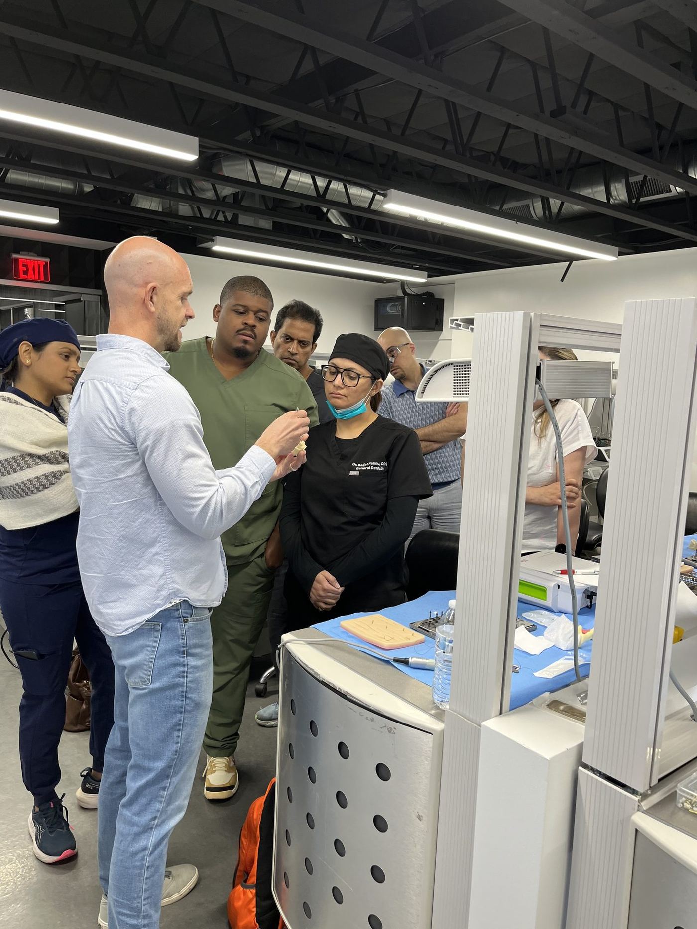 Dr. Blake Adams supervising a lateral window sinus lift on a live patient during the sinus lift course in Phoenix